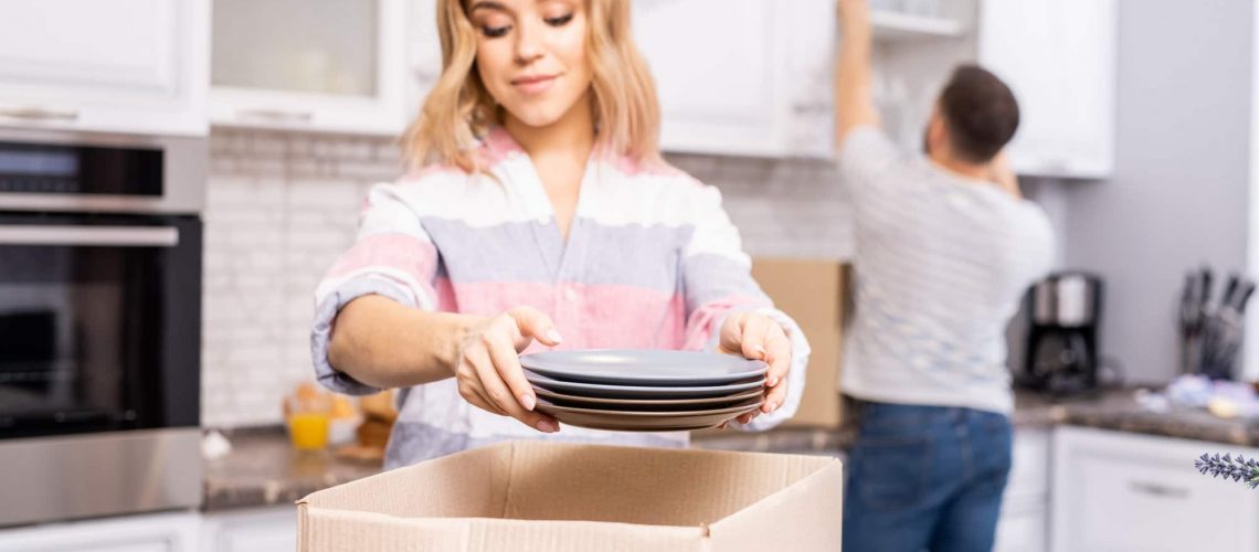 Couple Unpacking in Kitchen